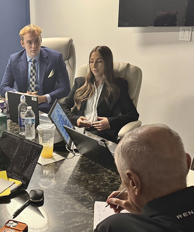 Hali Burnett speaks at a meeting at BNSF headquarters. Next to her is fellow intern Mickey Carrothers. Hali Burnett speaks at a meeting at BNSF headquarters. Next to her is fellow intern Mickey Carrothers.